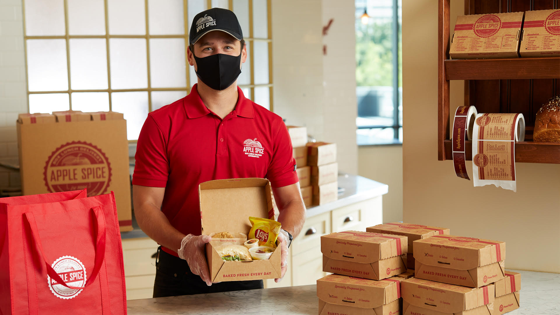 Apple Spice Staff holding Box Lunch Catering