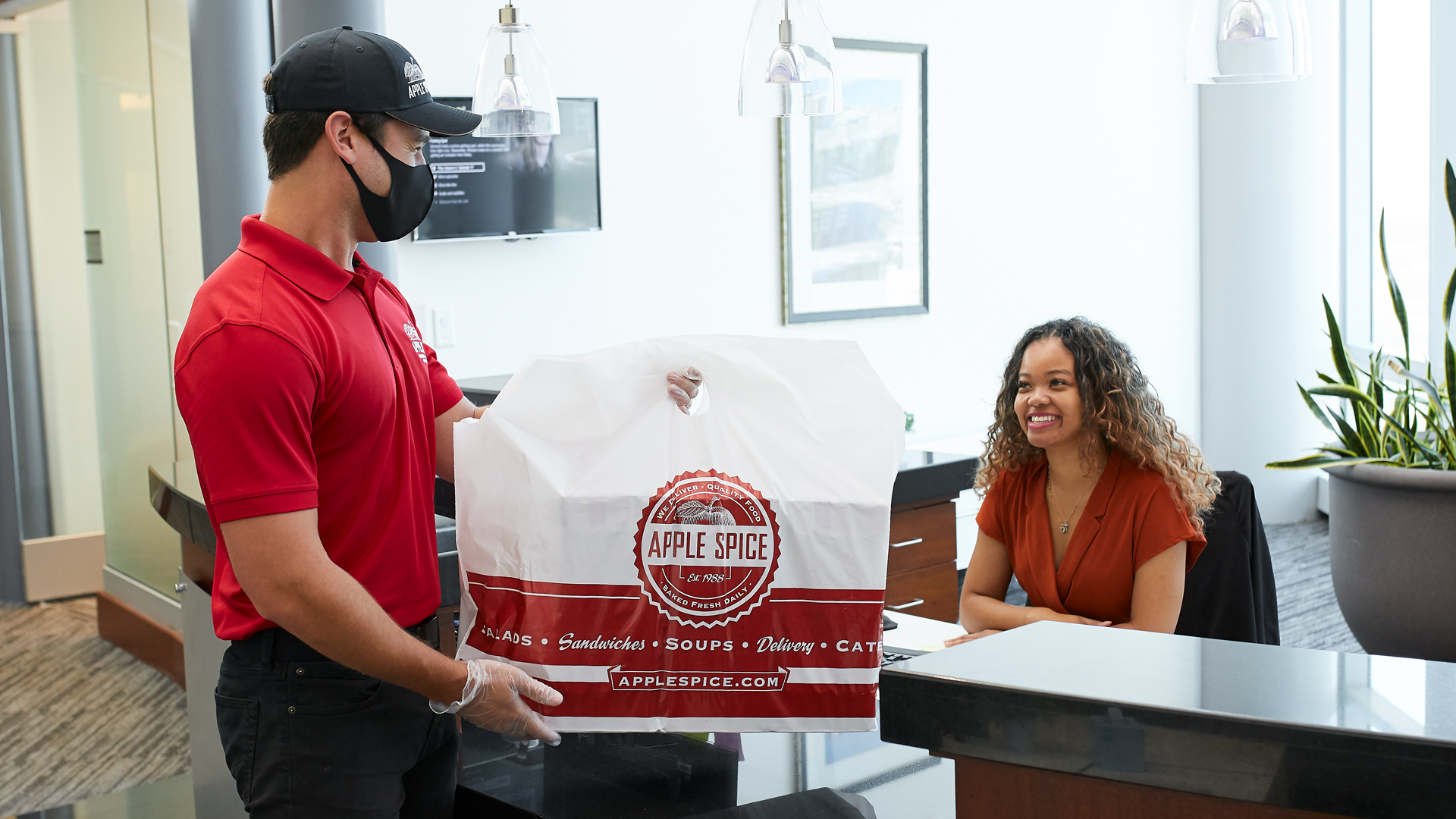 Apple Spice Catering Employee Delivers to Office for Catered Event