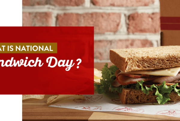 what is national sandwich day banner with sandwich in foreground