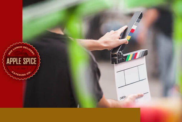 Man holding a film clapperboard