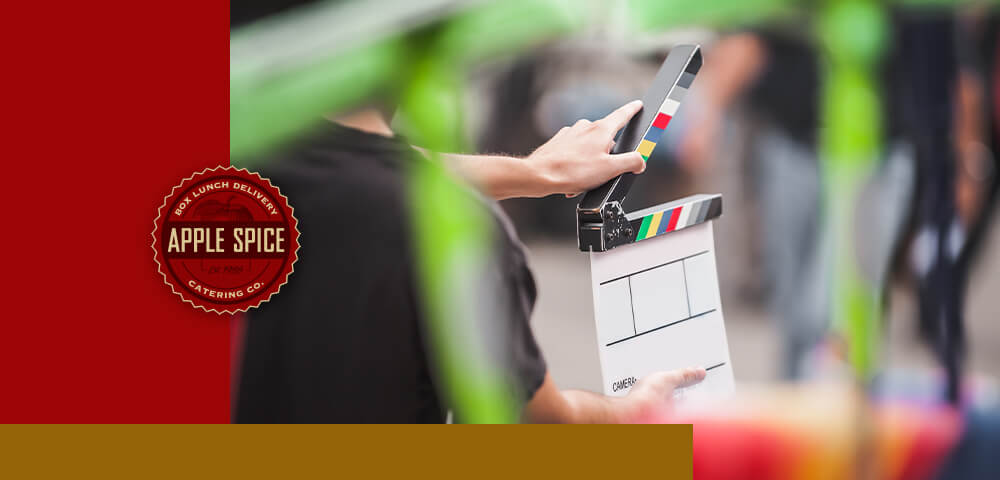 Man holding a film clapperboard